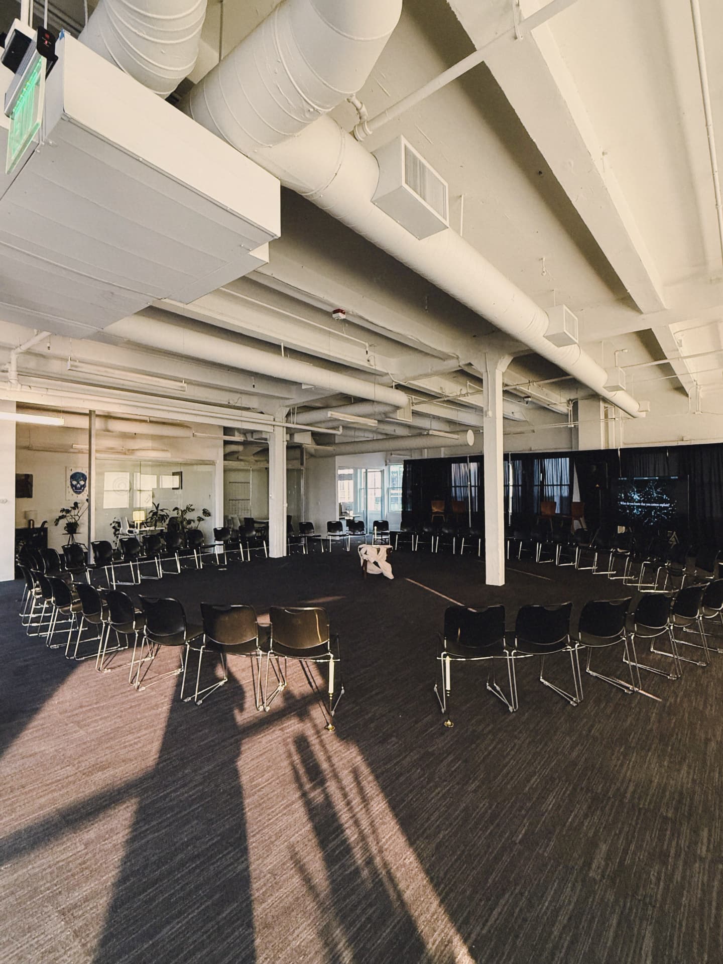 The room set in a wide circle of chairs before anyone arrived